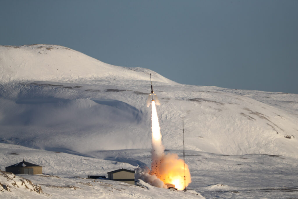 A rocket launches from a launch pad at Svalbard.